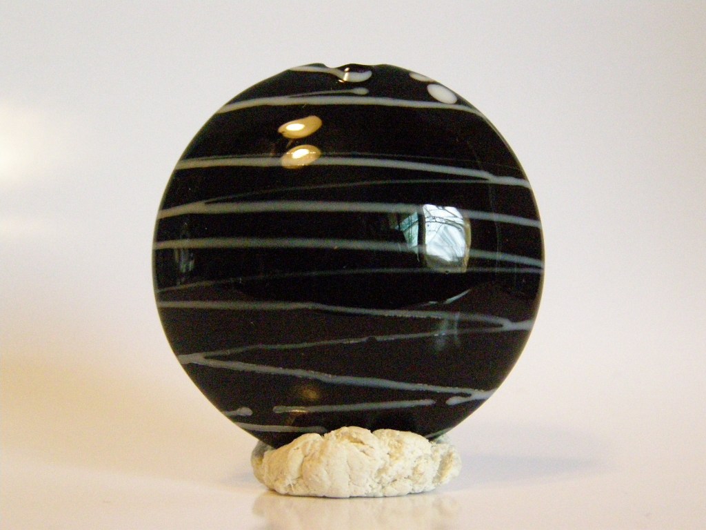 Black and white striped large lentil